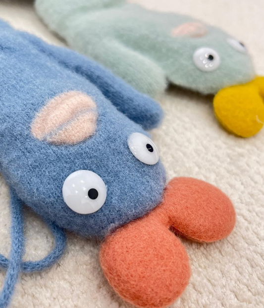 Children's knitted mittens with a cartoon design.