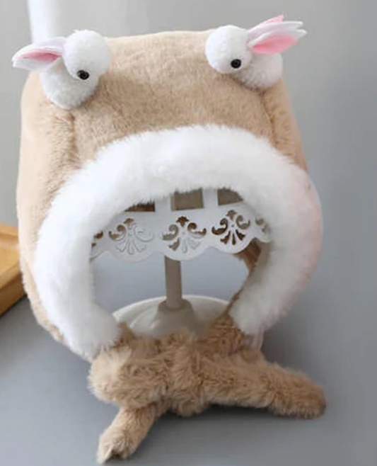 white plush beanie hat designed with rabbit ears.