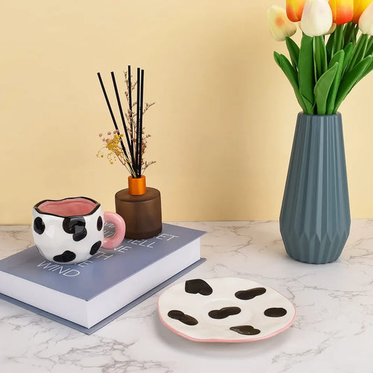 cow print ceramic coffee mug and saucer set.