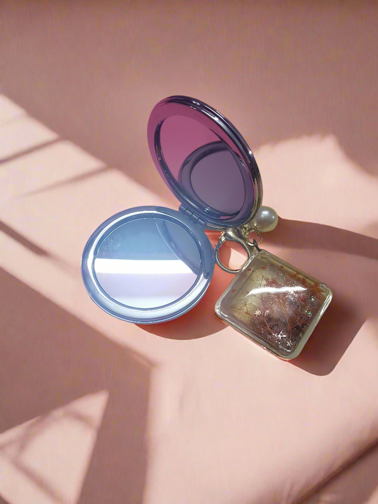 Glitter filled mirror with charm