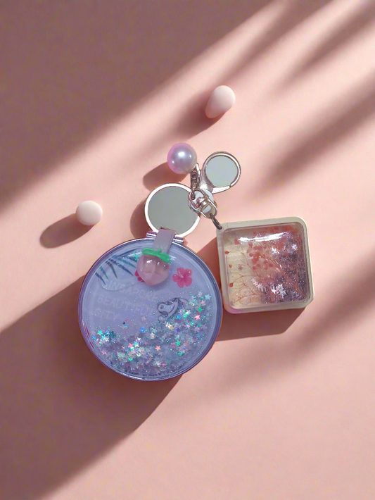 Glitter filled mirror with charm