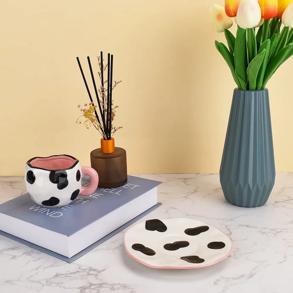 cow print ceramic coffee mug and saucer set.