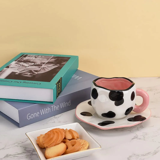 cow print ceramic coffee mug and saucer set.